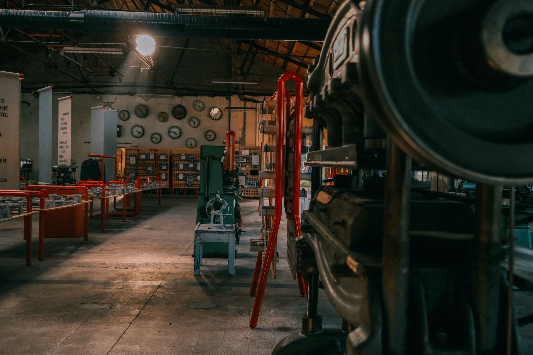 A single workshop lamp lighting a workbench after hours